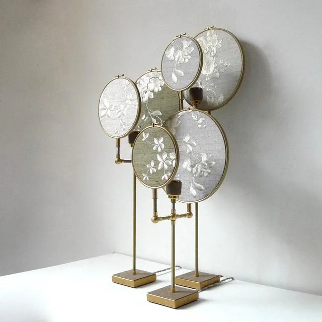 Ensemble of three table lamps, sander bottinga handmade in brass, leather, wood, hand printed and painted linen. A dimmer...