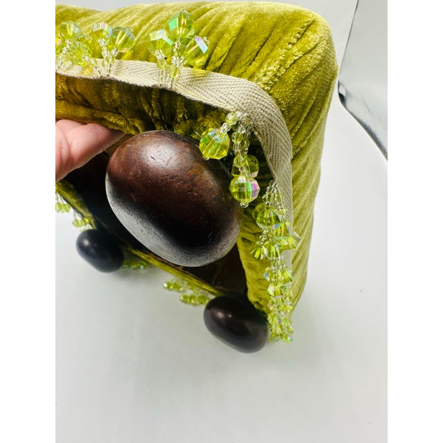 This antique footstool has been beautifully reupholstered to give it a fresh, luxurious look. The top is covered in a...