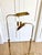 Pair of Frederick Cooper adjustable brass pharmacy floor lamps. They embody the refined, understated luxury for which the...