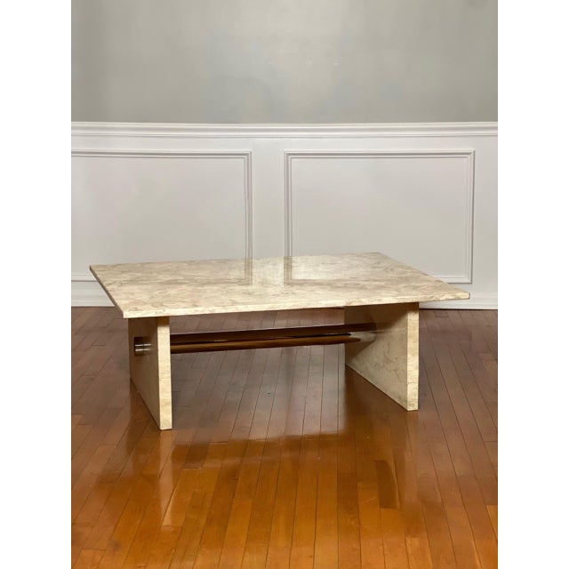Solid marble and chrome coffee table in cream, 1990s. A striking table comprised of a marble top and base joined by a...