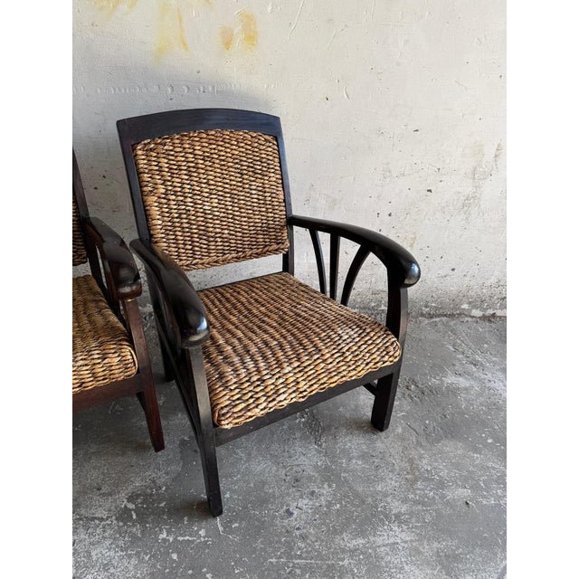 Set of two colonial rattan armchairs with wooden frame These beautiful armchairs combine a warm colonial style with robust...