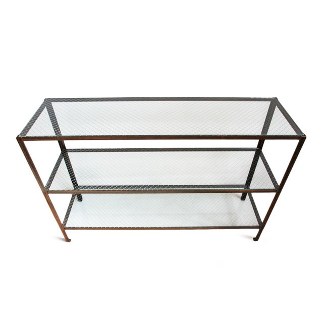Industrial console table / shelves with three mesco wire glass inset shelving in simple iron frame. Waxed and sealed rust...