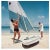 Boating In Antigua 1961 American actor Hugh O’Brian (left) hoists the sail on a dinghy, Antigua, West Indies, 1961. Slim...