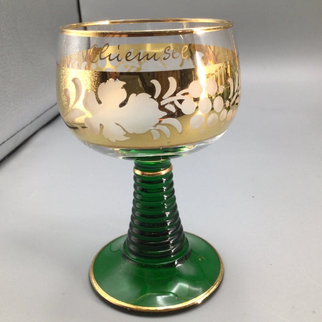 Here is a set of 13 french assorted emerald green beehive.stem goblets. 9 glasses have German towns on them and 4 are...
