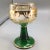 Here is a set of 13 french assorted emerald green beehive.stem goblets. 9 glasses have German towns on them and 4 are...