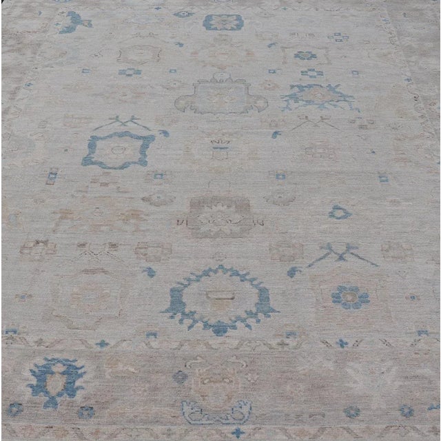 Modern Tribal Oushak Rug by Keivan Woven Arts, Off-White with Blue, 9'4" x 11'10 Modern Tribal oushak with light taupe...