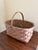 A beautifully handwoven early 20th century split oak basket with generous scale and a wonderfully time-softened surface....