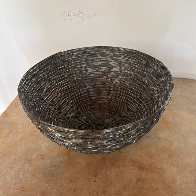 I haven’t a clue how this thing was made! Metal wire coiled into the shape of a bowl and then spot welded in place. This...