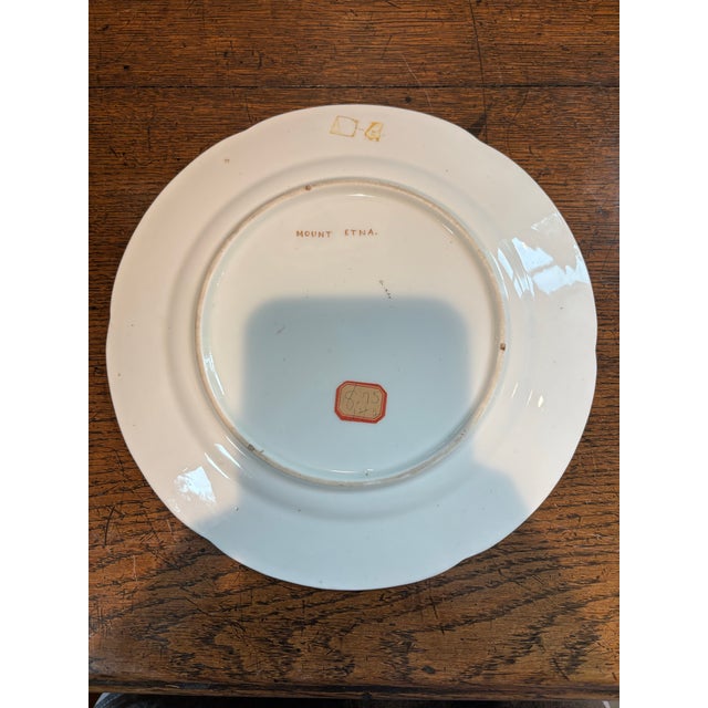 **Description:** An exquisite piece of early 19th-century British craftsmanship, this Regency-era porcelain cabinet plate...