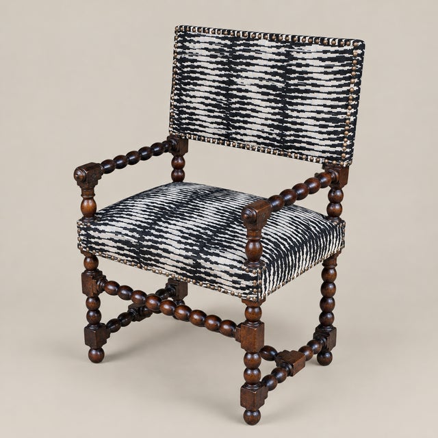 An exceptional Flemish Baroque-style carved wood armchair, estimated to date from the 17th or 18th century, with...