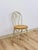 This charming vintage white metal bentwood style chair with caned seat is a clean and versatile accent seating find. The...
