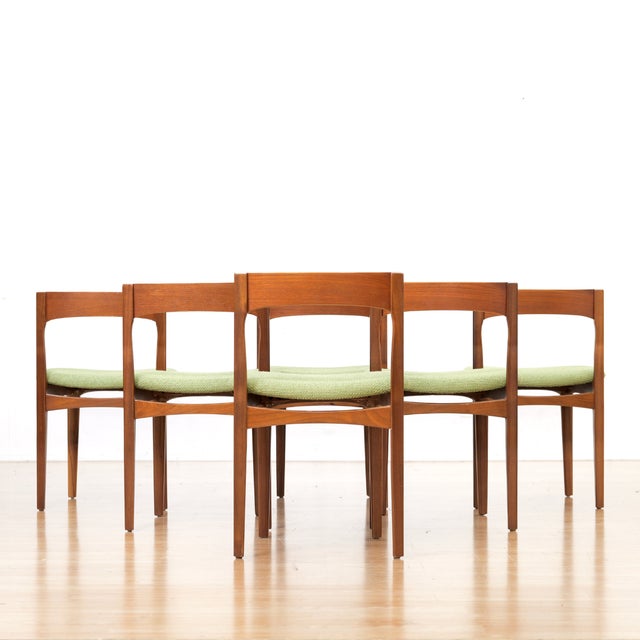 This stunning set of six dining chairs were produced in England during the 1960s. These vintage mid century chairs have...