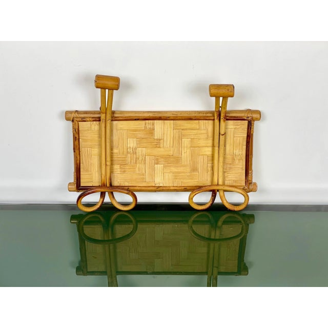 Rattan coat hanger featuring two hooks, Italy, circa 1960.