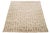 This hand-knotted organic Moroccan wool rug features a beige background with light brown accents, geometric designs, and...