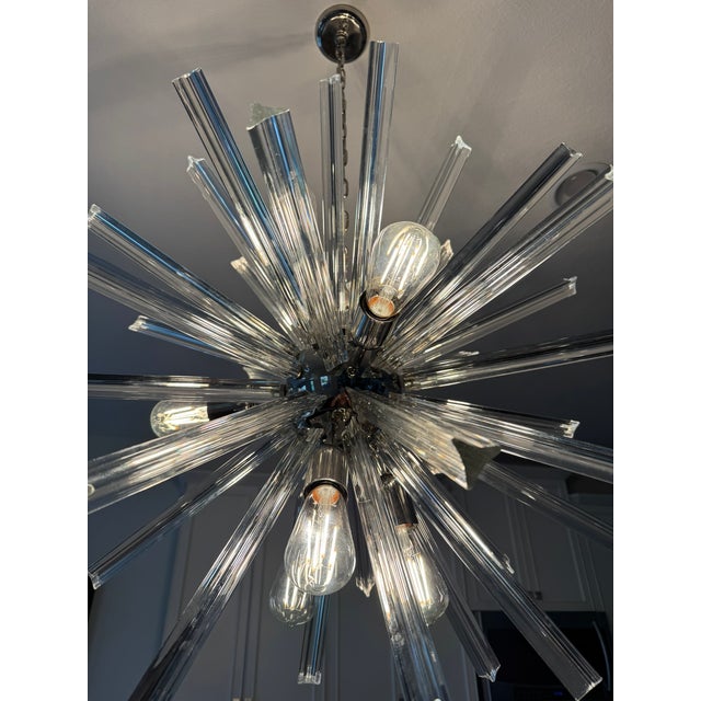 Stunning vintage Venini sputnik chandelier from the 70's. Chrome with 39 clear 12 inch triedri rods.