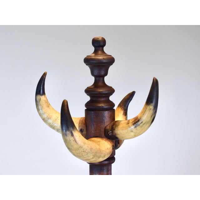 An early 20th C. Rancho American Cow horn hat and coat rack constructed of solid Mahogany, hand crafted with turnings,...