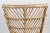 This basket armchair was designed by Gio Ponti and Lio Carminati. Ponti & Carminati originally designed this basket...