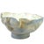 A large, sculptural bowl made of ceramic, decorated with underglaze crayon and glazed. The glaze inside the bowl is quite...