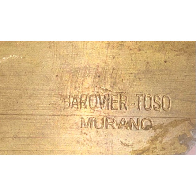 A refined and architecturally composed Murano wall sconce by Barovier & Toso, signed, featuring a hand-blown ribbed...