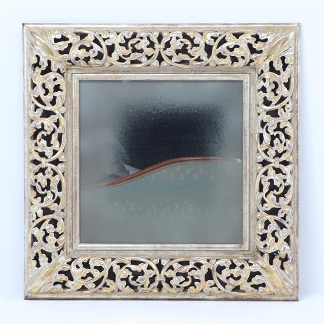 A modern silver gilt carved wood mirror.