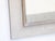 This modernist Heydenryk framed mirror has a textured white washed frame with a silvered trim. It is marked Heydenryk on...