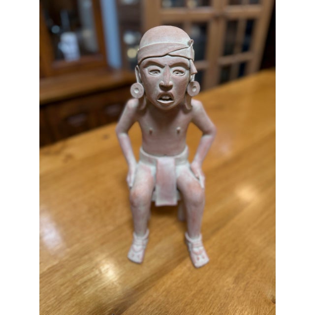 Design Plus Gallery presents an Antique Terracotta Sculpture. This beautifully preserved terracotta figure, shown in a...