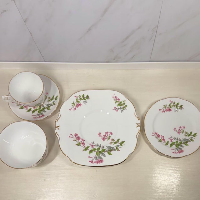 Each tea or luncheon setting from Collingwood China (Staffordshire, England) dates to the 1937–57 period and features pink...