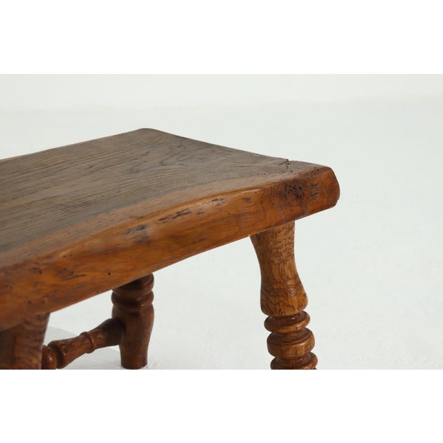 Plant or side table from the 1950s. The table has a decorative base with a rustic solid wooden top. Remains in good sturdy...