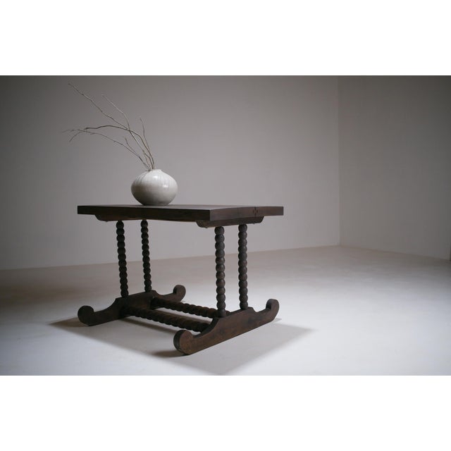 Rustic wooden coffee table, probably made in the late 19th century, with a hispanic-flemish vocabulary inspired by...