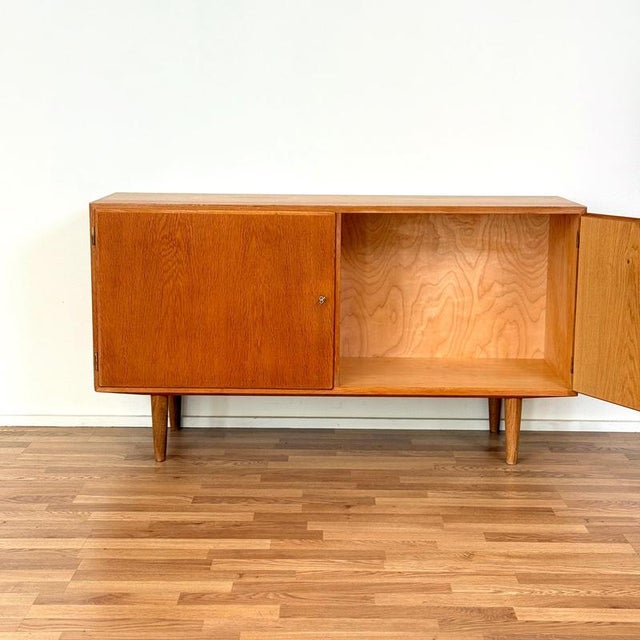 Sideboard made in Denmark in the 1950s-60s by Poul Hundevad. It is made of oak. The sideboard has been carefully restored...