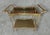 Beautiful 2 tiered vintage serving cart features a removable burl and smoked glass tray on the top with brass handles for...