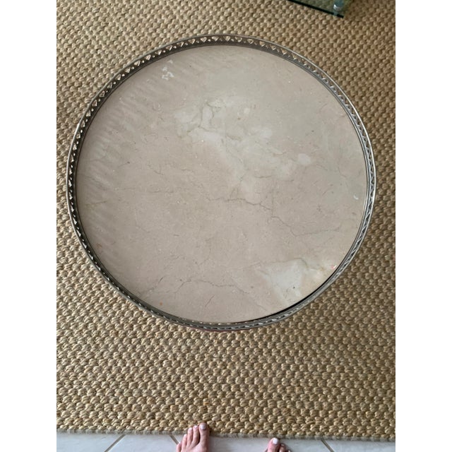 Antique table with beige marble The marble is new and the dark brown stain is new over a mahogany wood. The lions feet and...