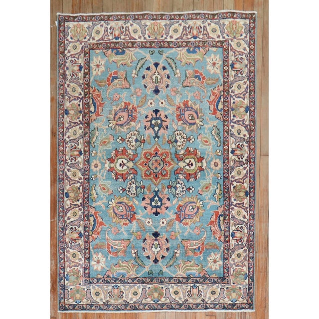A set of Persian Tabriz scatter-size rugs from the early 20th Century. One is more faded and lighter than the other....