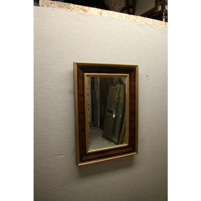 This exquisite antique Empire style ogee mirror dates back to the 19th century, showcasing timeless elegance and...