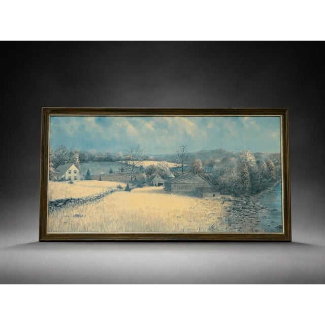 A large framed winter countryside landscape wall art piece featuring a peaceful rural scene with a farmhouse, barn, trees,...