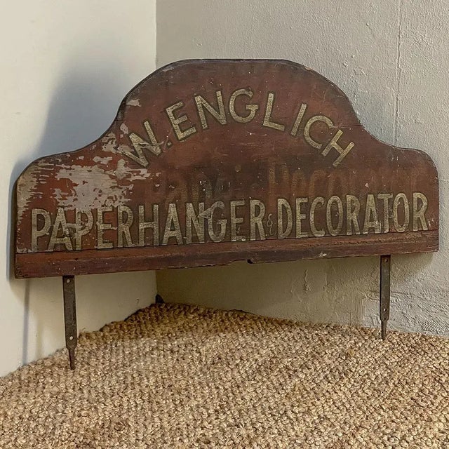 Antique English Shop Sign was cut from solid pine planks then hand-forged wrought iron straps were affixed to the back...