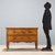 Chest of drawers in walnut and burl walnut, with maple and bois de violette trim. Two-drawer front, curved aprons and...