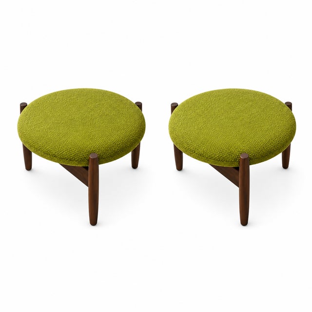Mid Century Style Round Walnut and Black Leather Ottomans Mid century style walnut and black leather ottomans. Manner of...