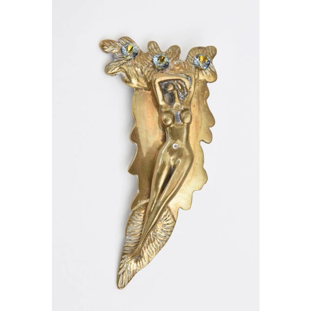 This studio one of a kind large, bold and sensual bronze sculptural designed belt buckle by Perella is most likely...