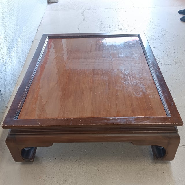 Vintage Low Chinese Ming Dynasty Kang Solid Wood Coffee Table With Clear Lacquer Recessed TableTop. The table is accented...