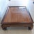 Vintage Low Chinese Ming Dynasty Kang Solid Wood Coffee Table With Clear Lacquer Recessed TableTop. The table is accented...