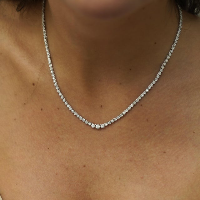 Natural 3.50 carat round diamond tennis necklace in 18K white gold and platinum 900 featuring graduated cupcake settings...