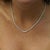 Natural 3.50 carat round diamond tennis necklace in 18K white gold and platinum 900 featuring graduated cupcake settings...