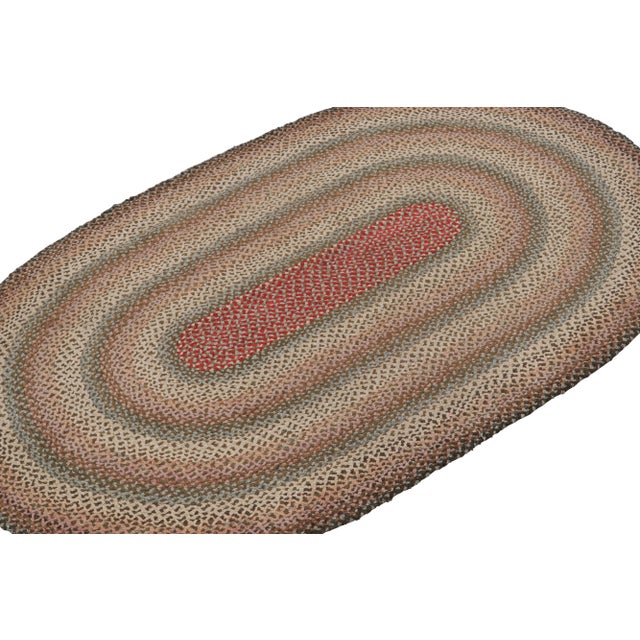 A rare 3x5 antique hooked oval rug of United States’ provenance, handmade in braided wool and fabric circa 1920-1930 with...