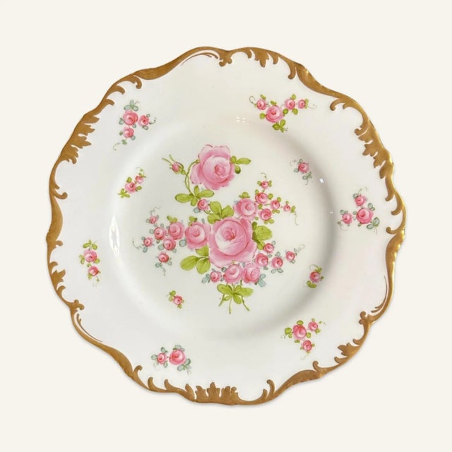 This set of 12 Crown Sutherland dinner plates is decorated with hand painted pink roses, green leaves and stems, finished...