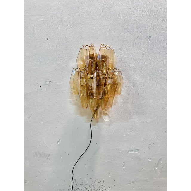 Stunning pair of vintage Murano blown-glass wall sconces from the 1970s, composed of a gilded brass frame and numerous...