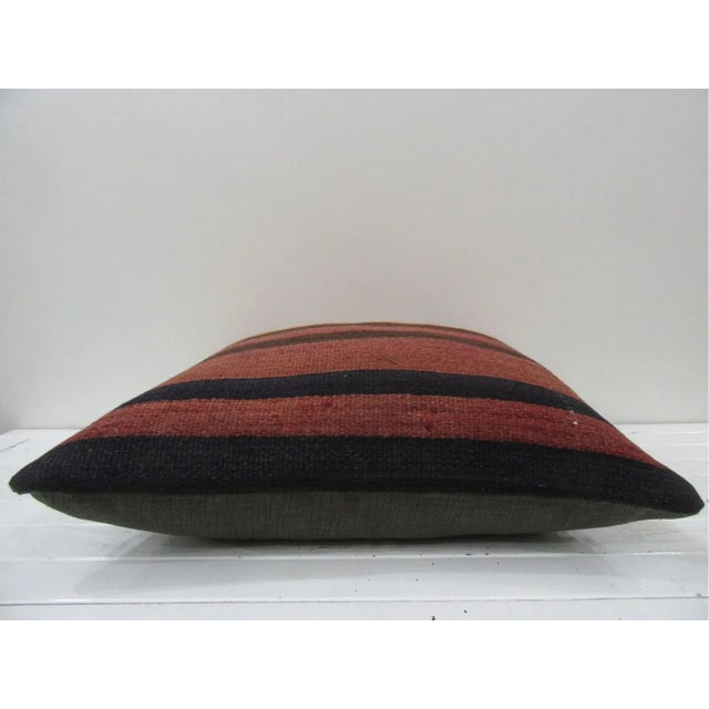 This is a pillow cover made from a vintage kilim rug. The piece was properly washed and ready to use. Pillow inserts not...