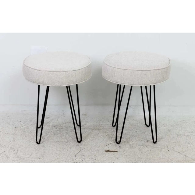 Circa 21st century pair of Mid-Century Modern style newly made upholstered benches with satin black hairpin shaped legs...