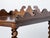 An English walnut barley twist four-tiered shelf with lower drawer, casters and carved three-quarter gallery at the top....