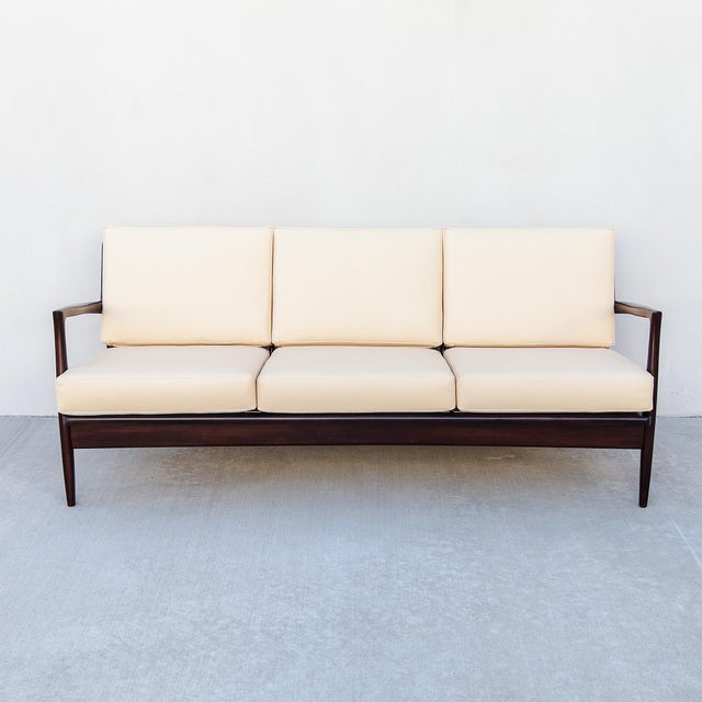 A Scandinavian mid century modern three-seater "Blade" sofa by Ib Kofod-Larsen for Selig, produced in Denmark c. 1960s and...